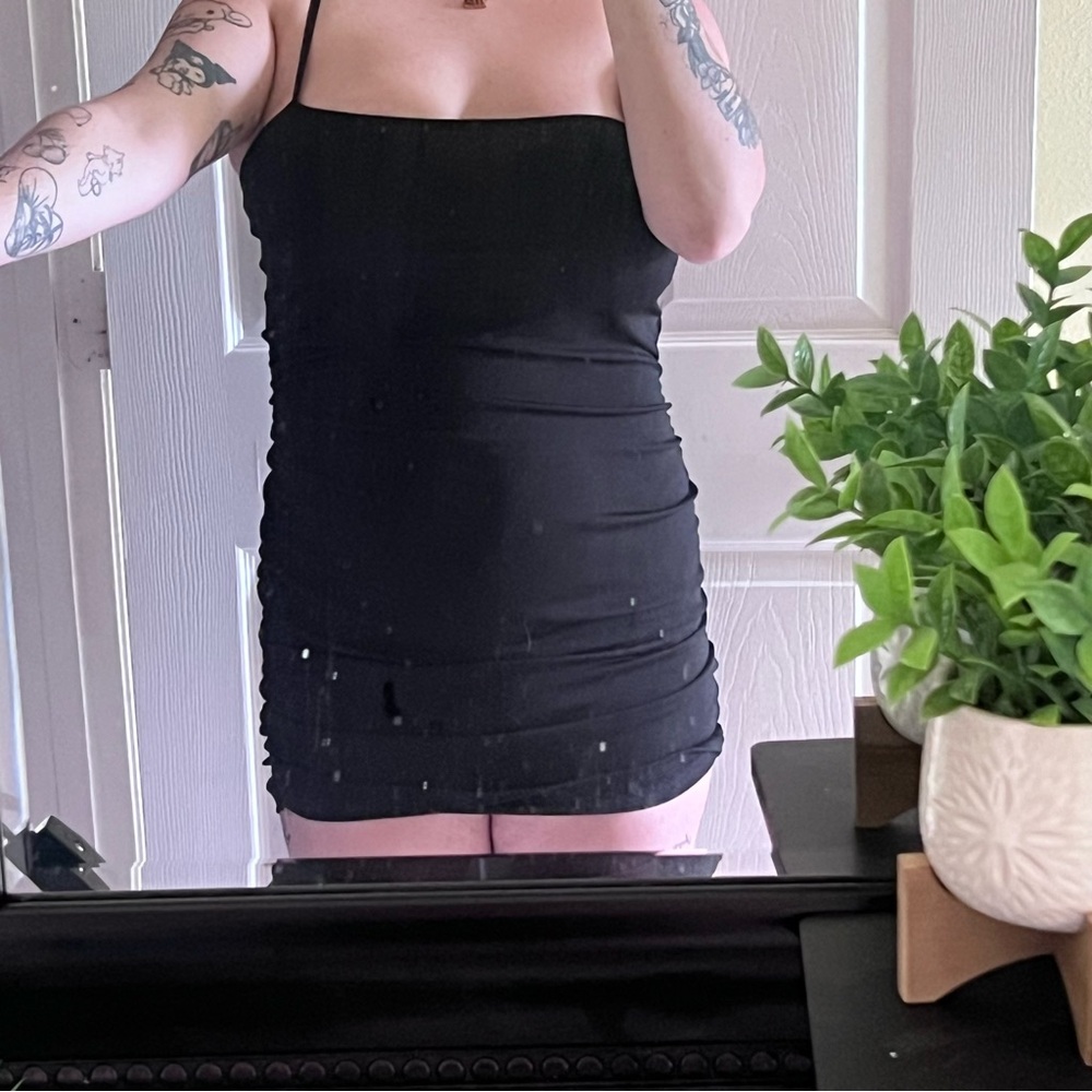 Sexy black ruched mini dress with a stretchy material